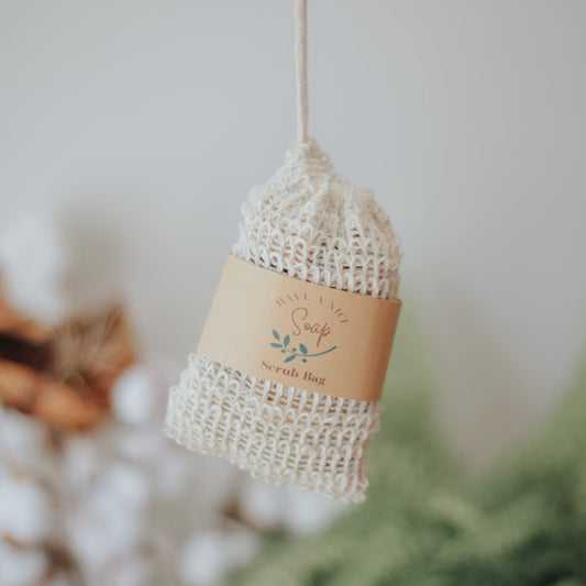 Exfoliating Soap Saver Bag filled with bits of natural soap made by Have A Nice Soap