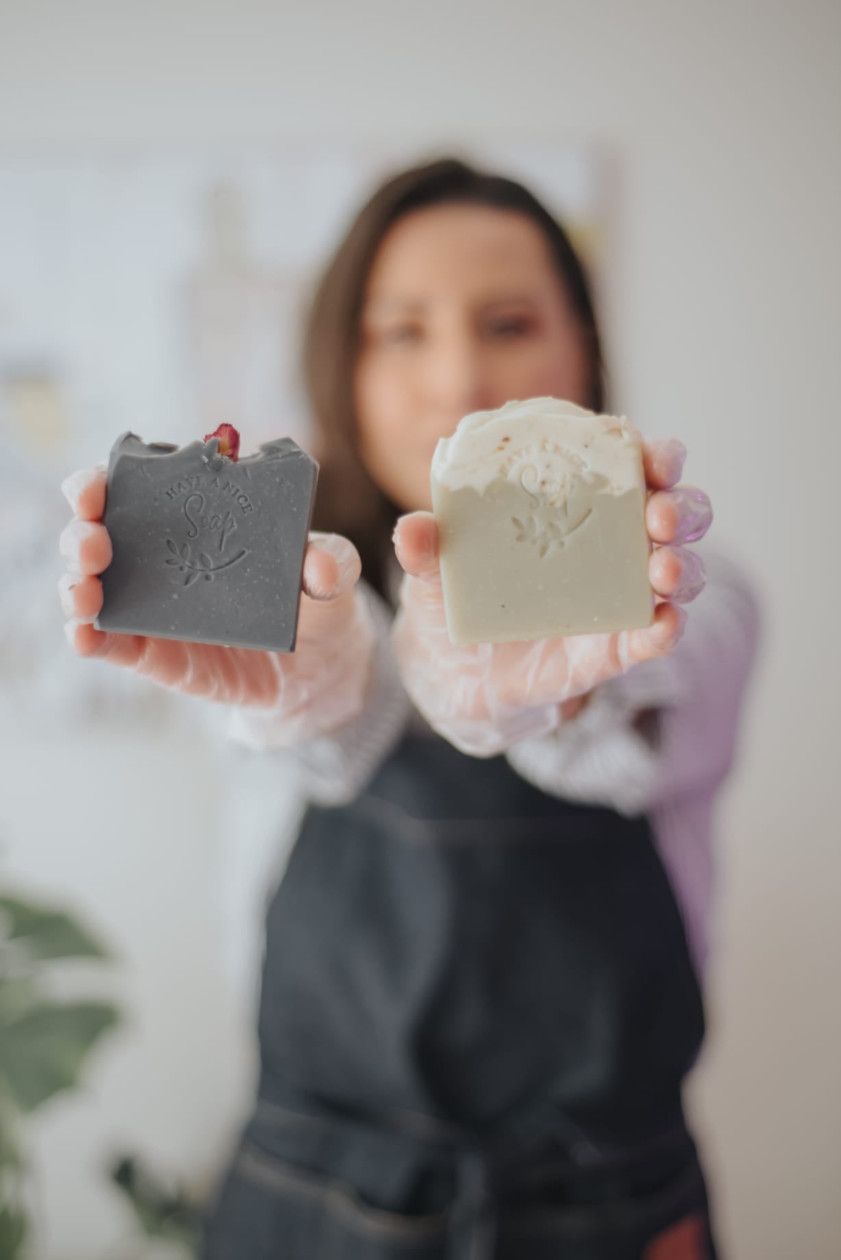Sustainable Irish Brand called Have A Nice Soap. Founder Christiane Chiodi holds up two natural soap bars she made in Ireland