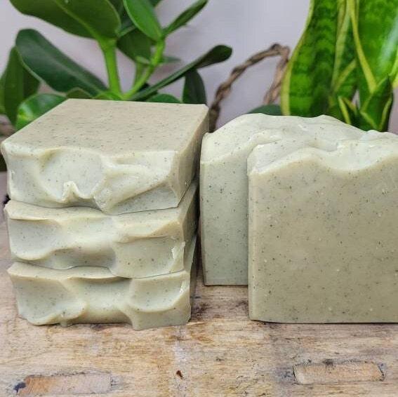 Five Lemongrass & Patchouli Natural Soap bars stacked on and beside each other